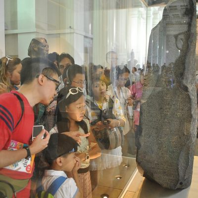Tourists visit the Rosetta Stone