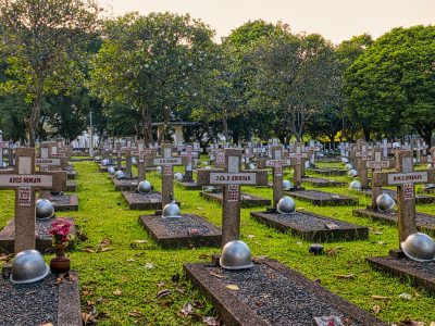 gravestones with crosses on cemetery